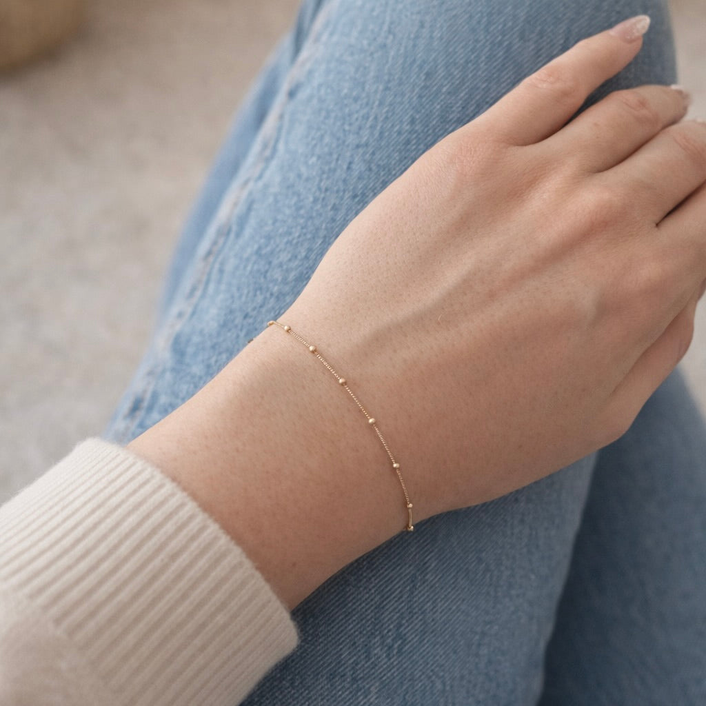 10k gold satellite bracelet on wrist