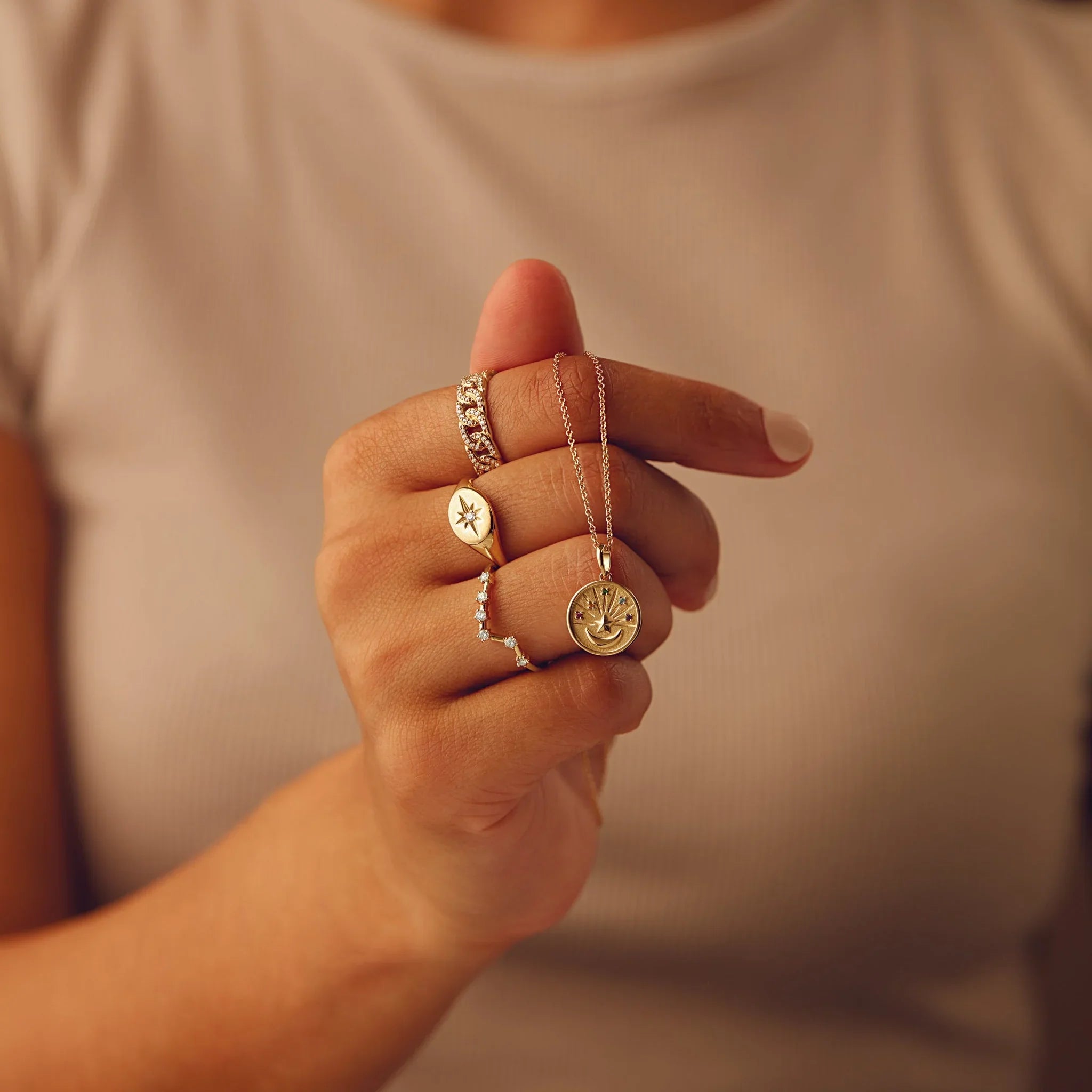 14k gold North Star ring with diamond accent – worn on hand