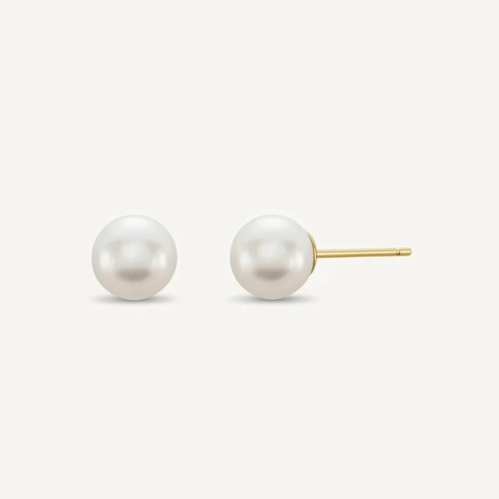 14k gold Pearl earring on a white background