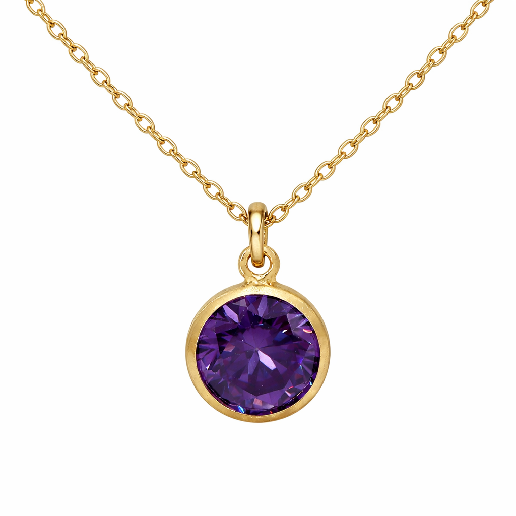 Gold birthstone necklace with a purple gemstone pendant on a white background