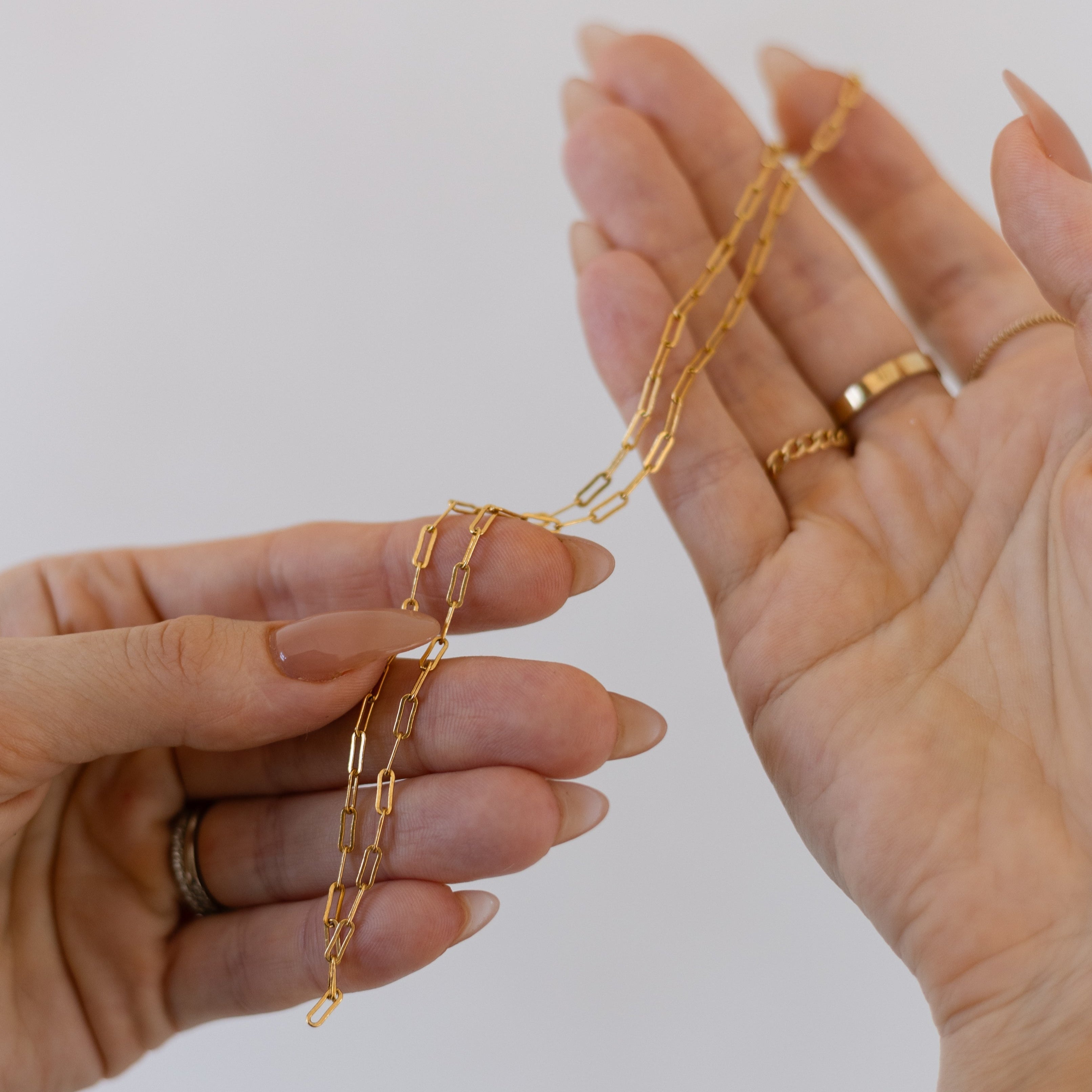 close up of gold paperclip necklace