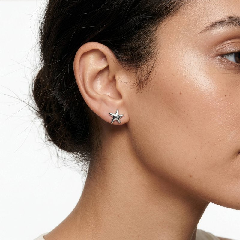 model wearing sterling silver starfish studs
