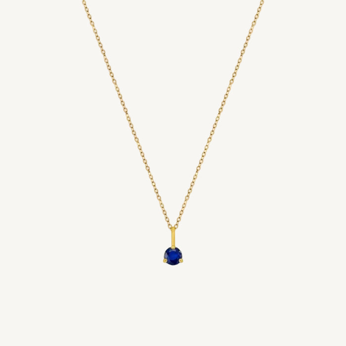Gold necklace with a sapphire pendant on a 10k gold chain