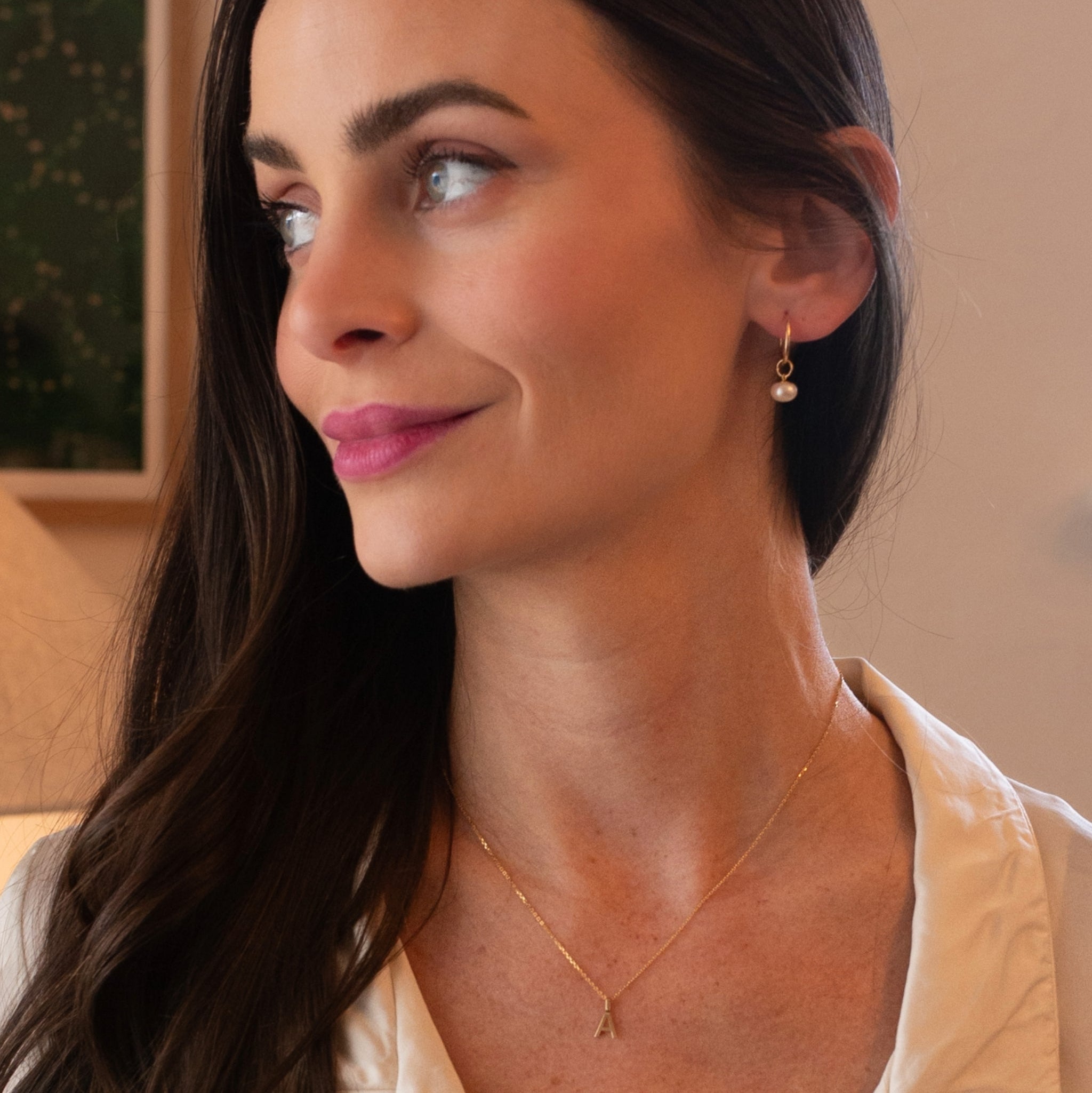 model wearing 10k gold personalized letter necklace