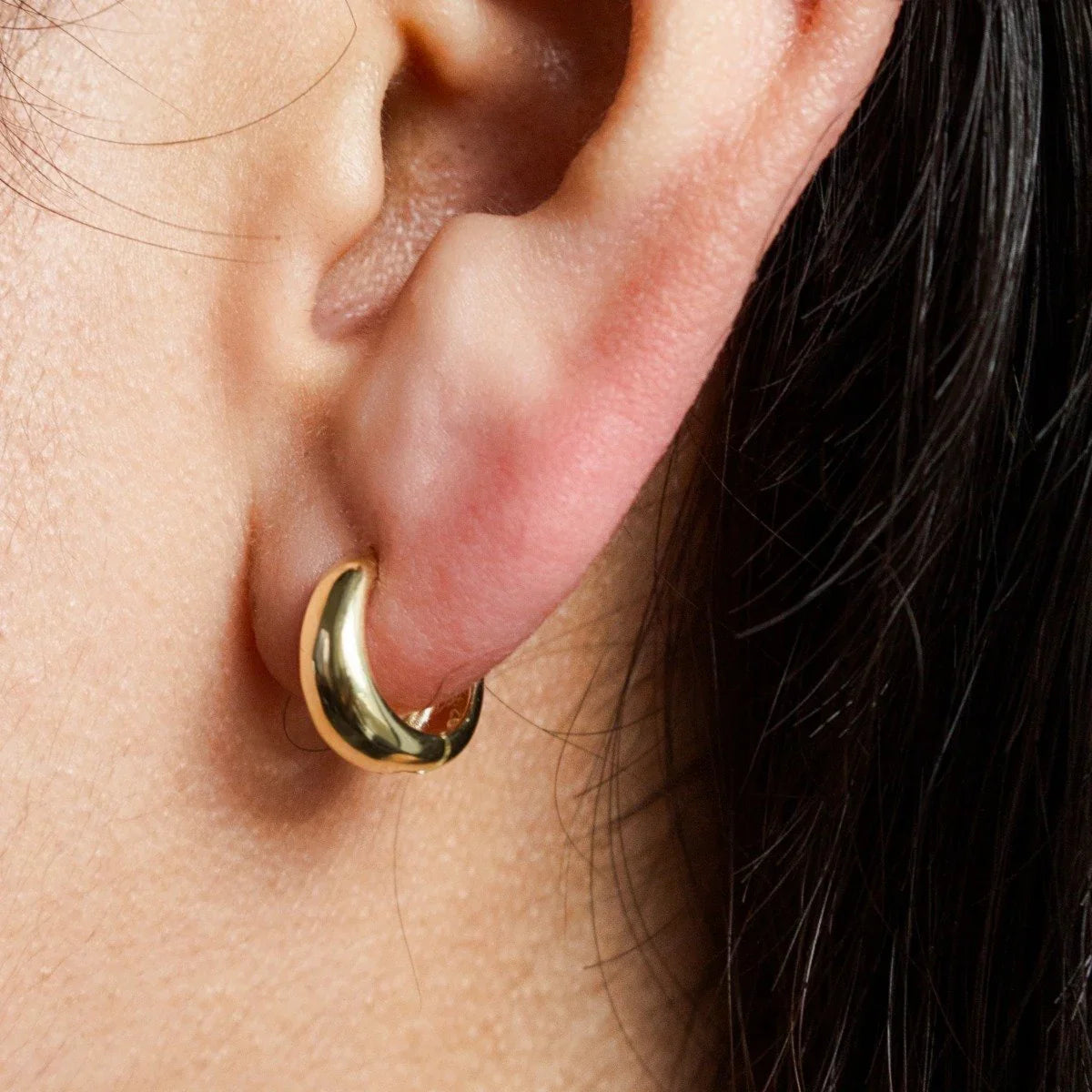 gold vermeil Dome Huggies on model