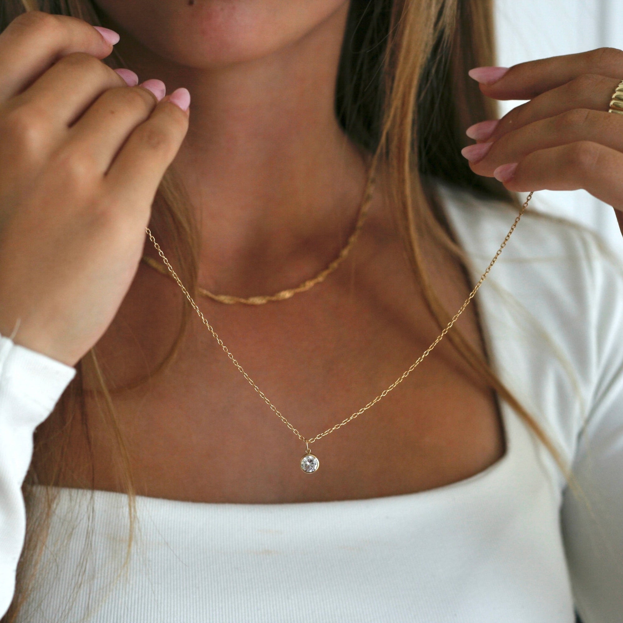 model holding gold filled birthstone necklace