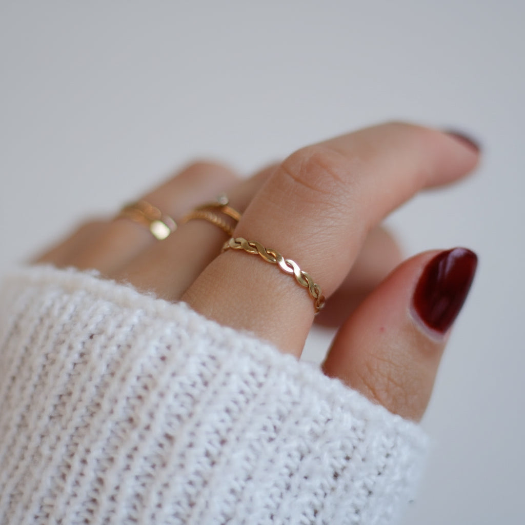 gold-filled braided stacking ring on hand