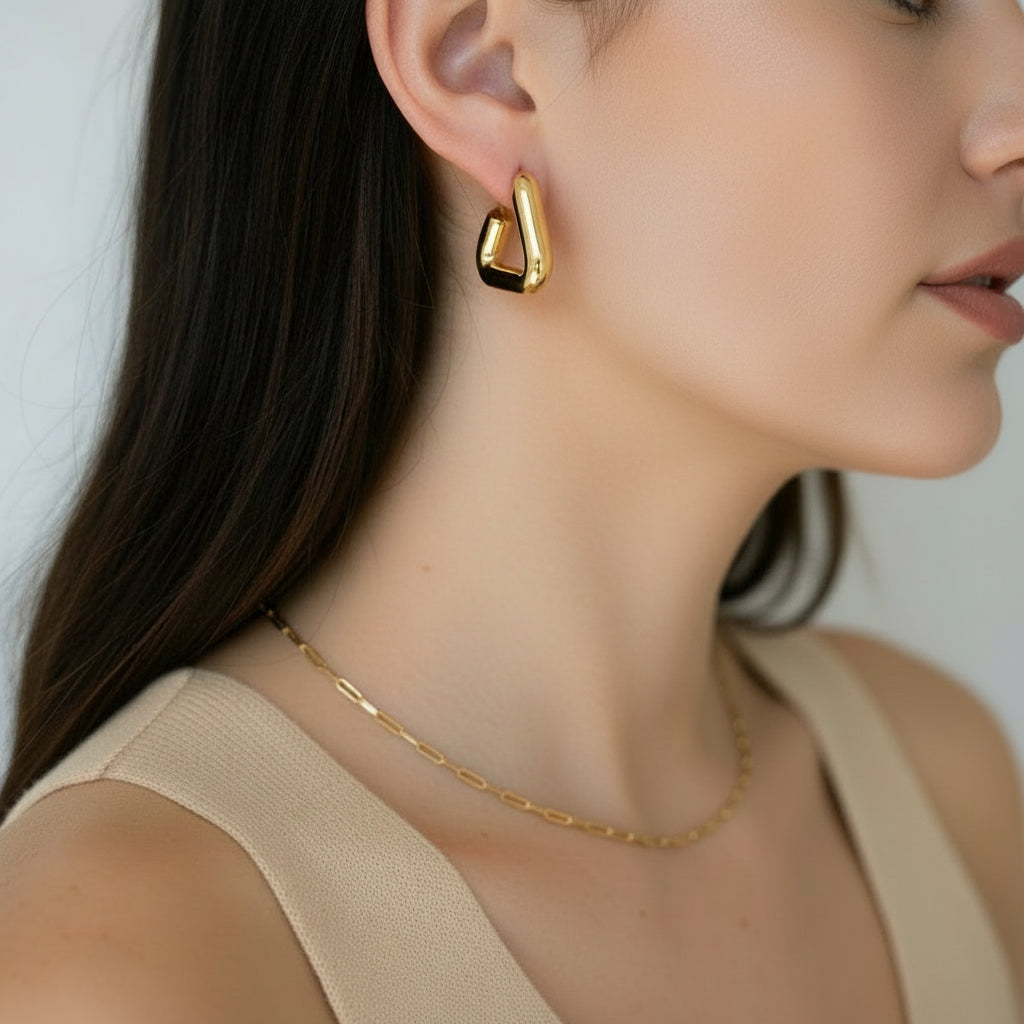 Gold plated Georgia triangle hoops – on ear view