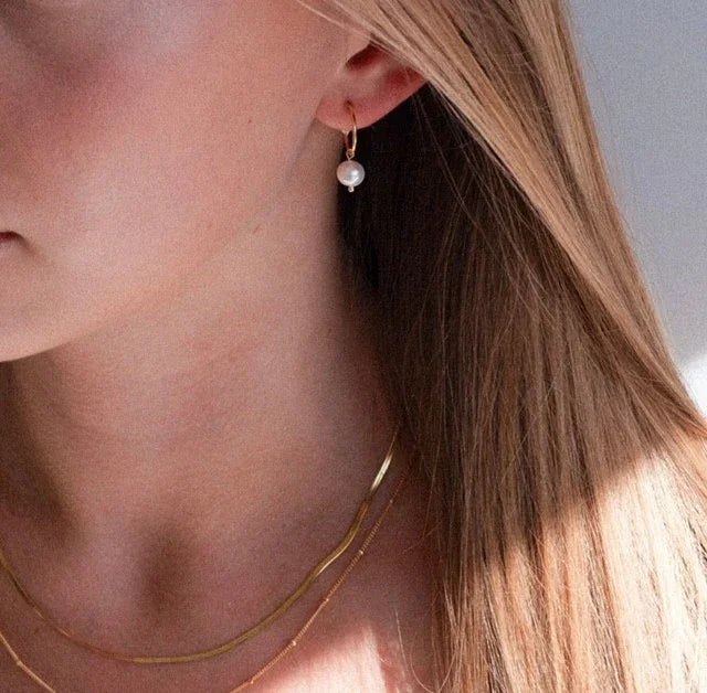 gold vermeil pearl hoops on model