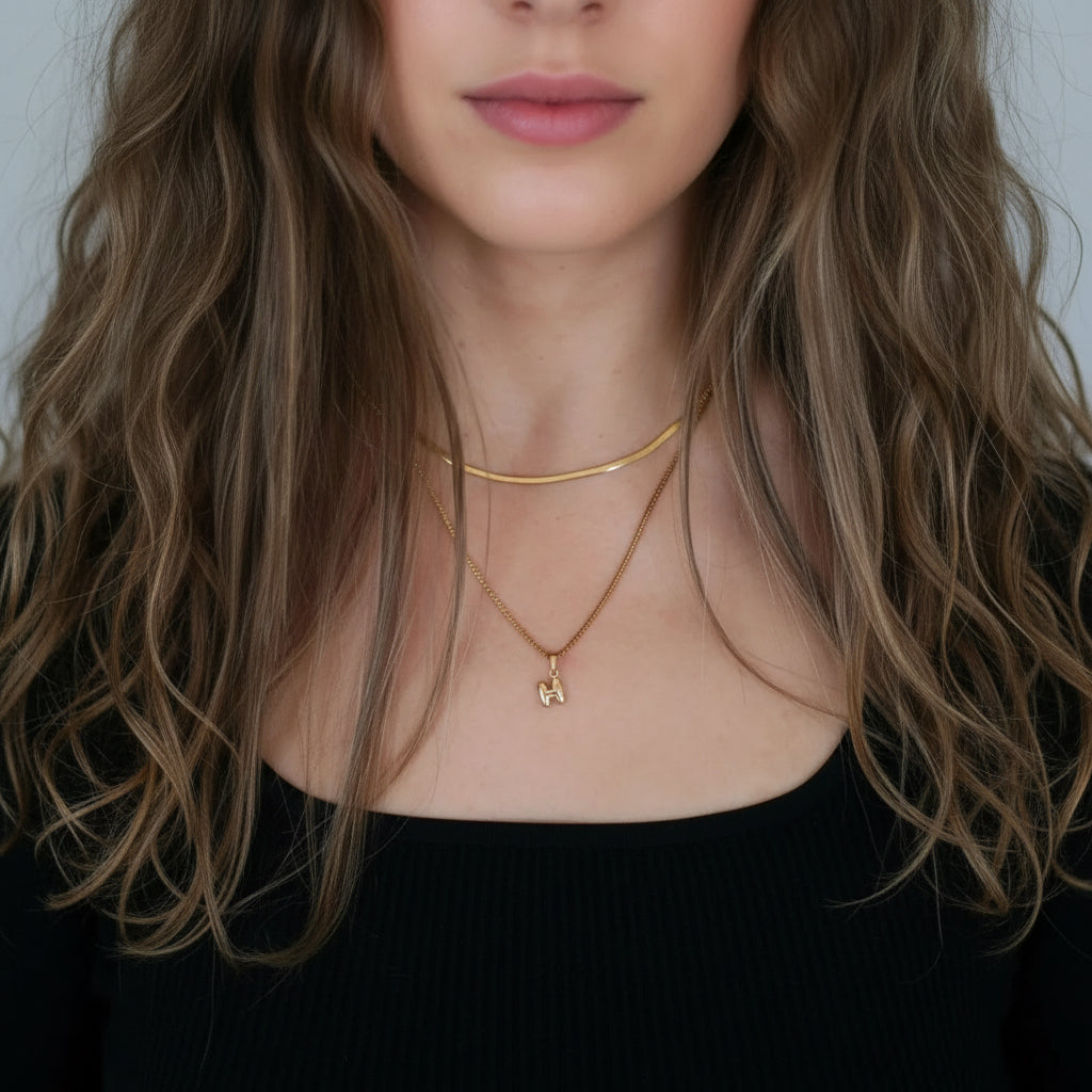 Petite puffed gold plated initial pendant necklace – on model