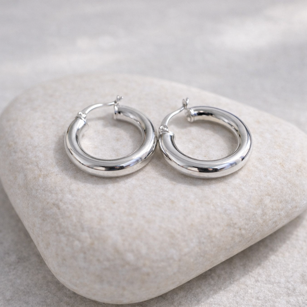 sterling silver chunky hoops on white rock
