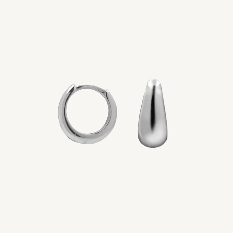 Two silver hoop earrings on a white background