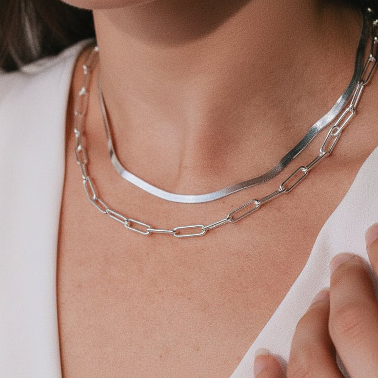 Bold sterling silver paperclip necklace layered with herringbone necklace
